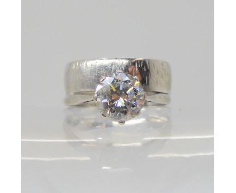 An 18ct white gold solitaire diamond ring and wedding band combined ring. Set with an estimated approx 1.70ct brilliant cut d