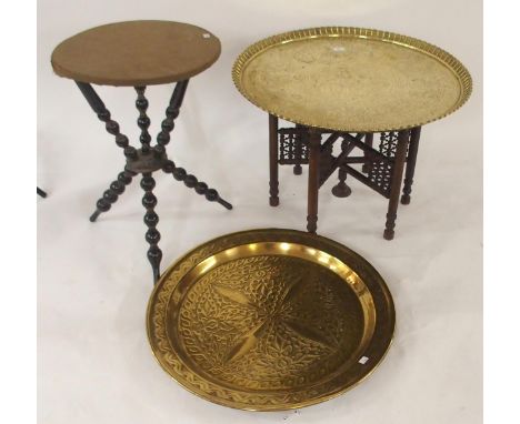 A 20th century Moorish style brass topped folding table, An ebonised circular topped table with turned bobbin uprights and an