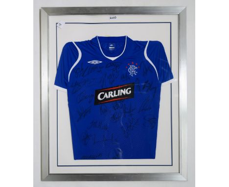 SPORTING MEMORABILIA A framed Glasgow Rangers 2008-09 home football shirt, with team signatures Condition Report:Available up
