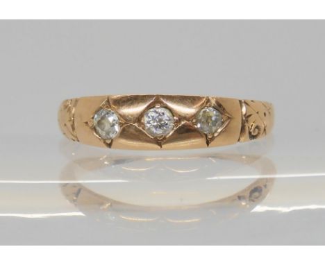 A rose coloured metal three stone diamond ring, set with estimated approx 0.12cts of old cut diamonds, size L1/2, weight 2.3g