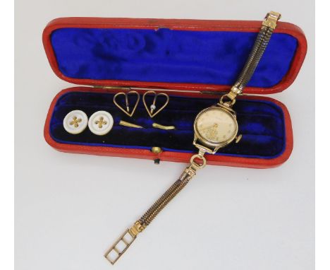 A 9ct gold cased ladies Cyma watch with gold plated strap, two yellow metal pearl set heart shaped shirt studs and two yellow