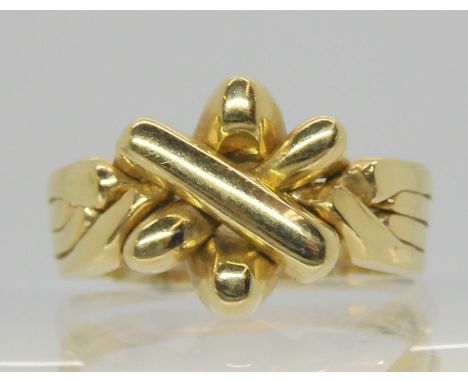 A 14k gold four piece puzzle ring, approx finger size W1/2, weight 7.8gms Condition Report:Available upon request