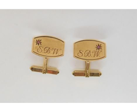 A pair of 9ct gold monogrammed ruby set cufflinks, weight 5.6gms Condition Report:Available upon request