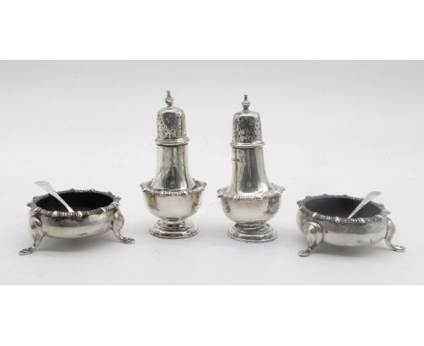 A four piece silver cruet set, comprising a pair of baluster form casters and a pair of open salts, on three hoof feet, with 