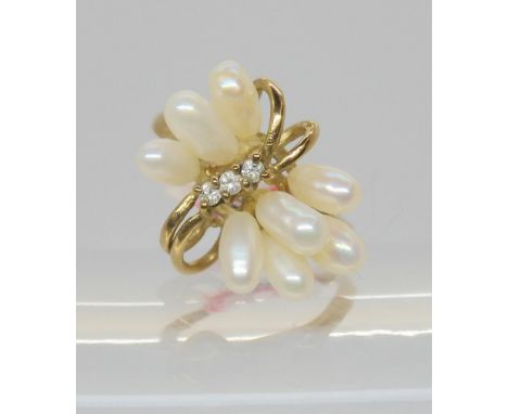 A 9ct gold pearl and diamond cluster ring, size L1/2, weight 2.8gms Condition Report:Available upon request