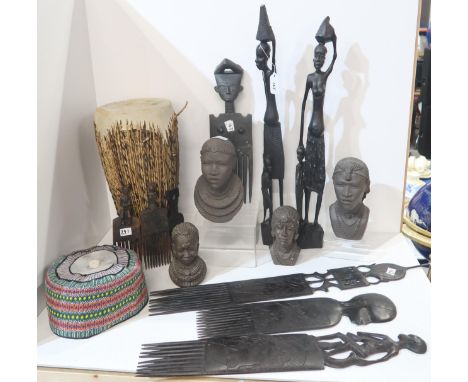 A collection of African tribal items including a drum, assorted Afro combs, figures, painted material pictures etc Condition 