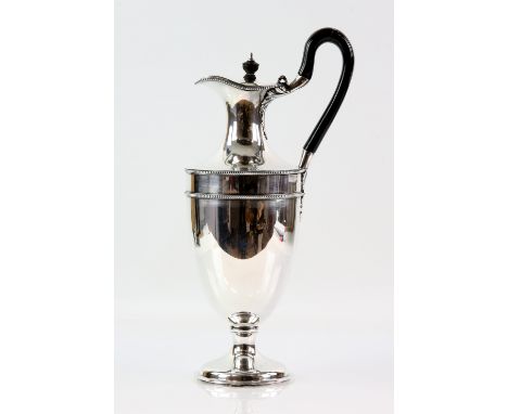 Victorian silver claret jug, the plain body with beaded borders, by Army &amp; Navy Cooperative Society Ltd., London 1882, 22