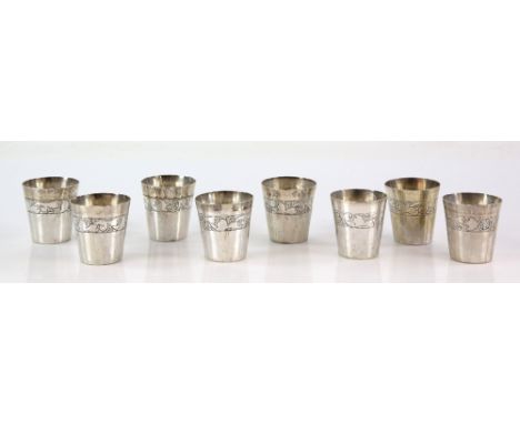 Set of eight Peruvian white metal tot cups, each with scrolling floral band and stamped WELSCH PLATA 900 to the underside, 5.
