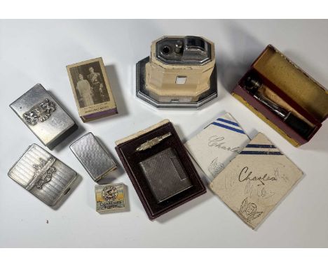 A hallmarked silver matchbox cover, engine turned panels, approx 20g, together with a white metal matchbook case with HMS Hoo