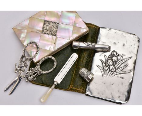 A BAG OF LATE VICTORIAN AND EARLY 20TH CENTURY SILVER SEWING ACCESSORIES AND OTHER ITEMS, comprising a silver mounted green l