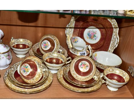 A TWENTY ONE PIECE HAMMERSLEY TEA SET, in pattern 2396, with red and gilt borders around a central panel of flowers, comprisi