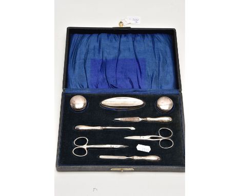 AN EARLY 20TH CENTURY CASED SILVER MANICURE SET, case opens to reveal two small glass jars with silver lids, a silver handled