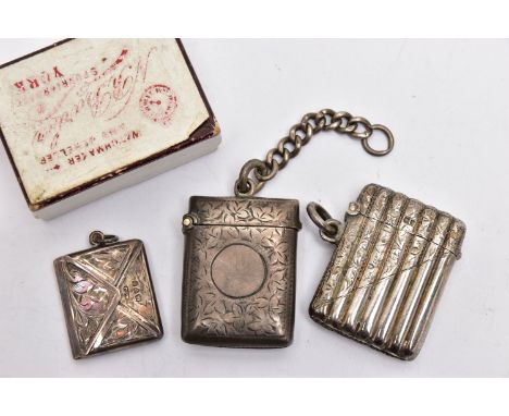 TWO SILVER VESTA CASES AND A STAMP HOLDER, the first vesta of a rectangular form, decorated with a floral pattern and vacant 