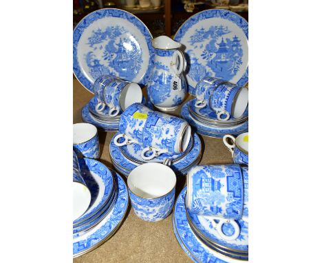 A SET OF ROYAL WORCESTER BLUE AND WHITE 'WILLOW' PATTERN TEAWARES B389, comprising two cake plates, one jug (crazing in the b