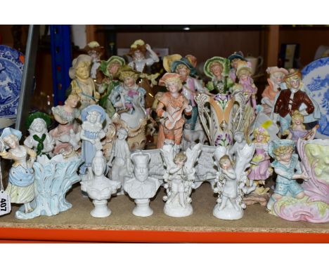 A QUANTITY OF GERMAN BISQUE FIGURINES, comprising a pair of Staffordshire figural posy vases (missing a hand and chipped lily