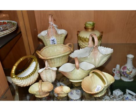 TEN ROYAL WORCESTER/LOCKE &amp; CO BLUSH IVORY BASKETS, mostly modelled as wicker, with gilt details, to include a Royal Worc
