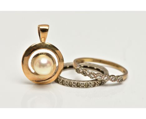 A 9CT GOLD PENDANT AND RING WITH A WHITE METAL RING, the first a yellow gold circular pendant, centrally set with a single wh