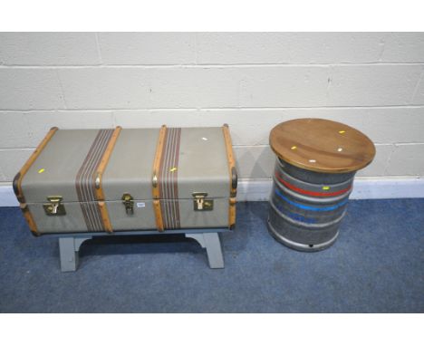 A BESPOKE COFFEE TABLE, made from a vintage canvass traveling trunk, on painted wooden legs, length 91cm x depth 52cm x heigh