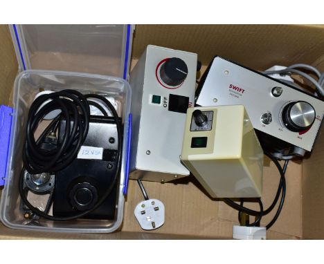 A BOX CONTAINING MICROSCOPE POWER SUPPLY UNITS, comprising a Watson illumination unit with power supply, Swift power supply, 