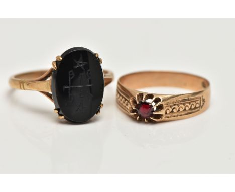 TWO GEM SET RINGS, the first an oval onyx with carved detail, prong set in yellow metal, trifurcated shoulders, stamped 9ct, 