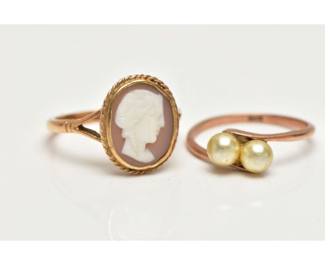 TWO GEM SET RINGS, the first a yellow metal ring set with two imitation pearls in a bypass mount, stamped 9ct, ring size N, t