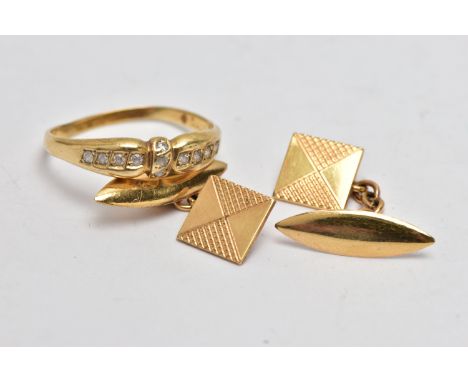 A YELLOW METAL RING AND A PAIR OF CUFFLINKS, the ring set with colourless pastes, to a polished band, stamped 585, ring size 