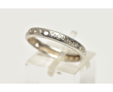 A WHITE METAL DIAMOND SET FULL ETERNITY RING, polished band, set with single cut diamonds (three stones are missing), rubbed 