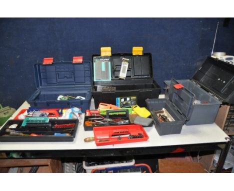 FOUR PLASTIC TOOLBOXES CONTAINING TOOLS including hammers, drill bits, pliers, screwdrivers, pipe cutters, and wrenches, leve