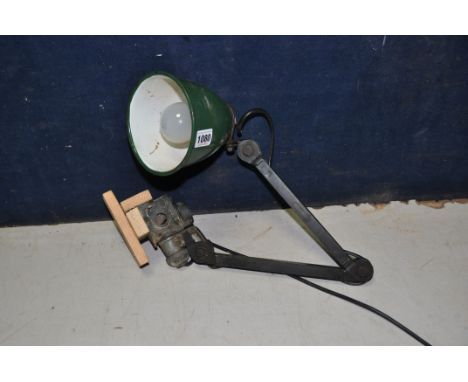 A VINTAGE ARTICULATED WORKSHOP LAMP with green and white painted shade (PAT pass and working)