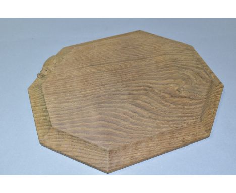 A ROBERT 'MOUSEMAN' THOMPSON OAK BREAD BOARD, of octagonal form, modern and appears unused, approximate size 24.5cm x 30cm (1