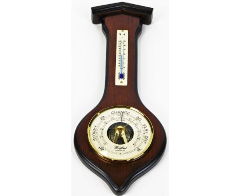 Woodford. A mahogany cased wall barometer and thermometer, in shaped case with 9cm diameter dial, 38cm high. 