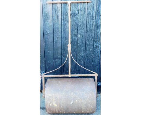 An early 20thC cast iron garden roller, with cylindrical roller and wrought iron frame with T shaped handle, 146cm high. 
