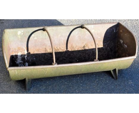A cast iron feeding trough planter, on shaped stiles, with sectional interior, 28cm high, 21cm wide, 32cm deep.  