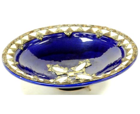 A highly decorative blue glaze pottery bowl, raised with mother of pearl finish and other metal mounts with a shaped centre a