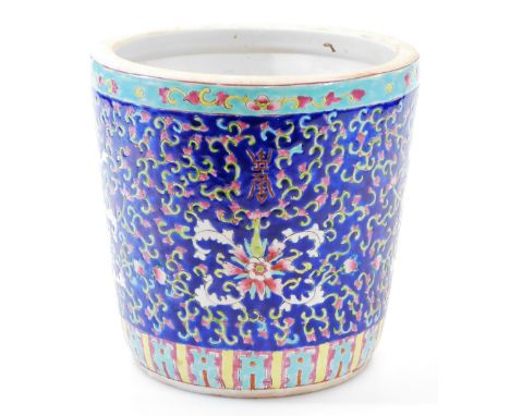 A 20thC Chinese famille bleu planter, of tapering cylindrical form, decorated with flowers on a blue ground with a turquoise 