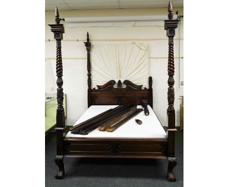 A 20thC hardwood four poster bed, composed with four turned posts set with acanthus leaf and flower head mouldings, a headboa