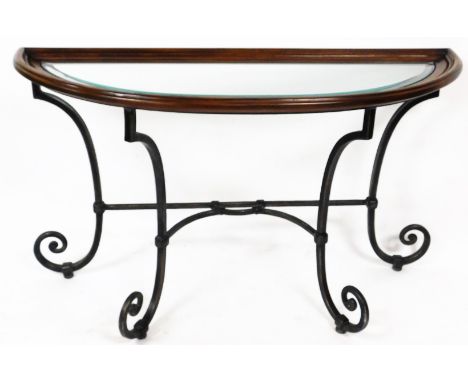 A 20thC D-end console table, with glazed top in a moulded framework on a wrought iron scroll stand, with elaborate stretcher,