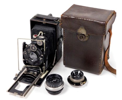 A 20thC Zeiss Ikon camera, with various accessories including enlarger lenses,  and leather case, with visible stitching, 15c