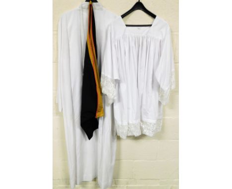 An ecclesiastical vestment robe, with Wippell and Co Exeter label in white, a sash a further robe with cord bearing label, la