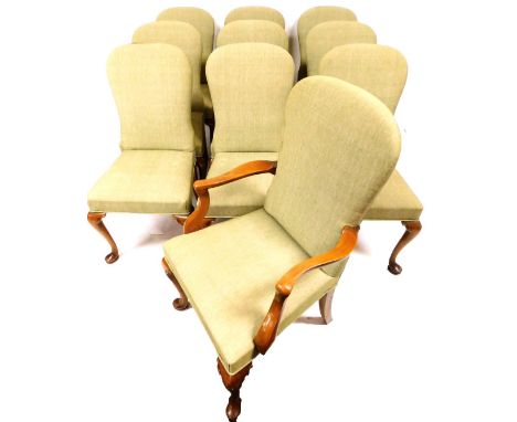 A set of nine (8+1) Beresford &amp; Hicks walnut framed dining chairs, each with elongated spoon backs and plain seats, overs