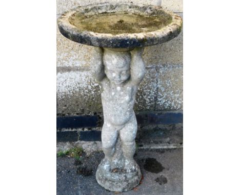 A late 20thC classical style bird bath, with circular top raised on cherub stem terminating in step base, 74cm high, 33cm dia