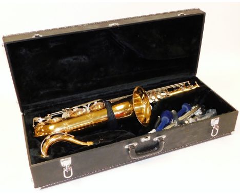 An Earlham French saxophone, with mother of pearl finished buttons, separate mouth piece and other accessories, in a fitted c