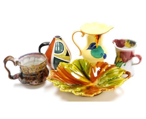 A Schramberg Majolica leaf shaped dish, with moulded handle, impressed mark beneath, 25cm wide, a Devon ware Art Deco jug, gl