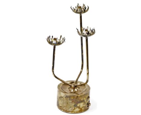 An Elizabeth II silver Jubilee three branch table light, with shaped stem, flame dish holders and circular lead centred base,