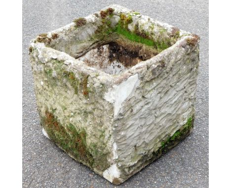 A stone planter, of square form, 36cm high, 36cm wide, 36cm deep. 