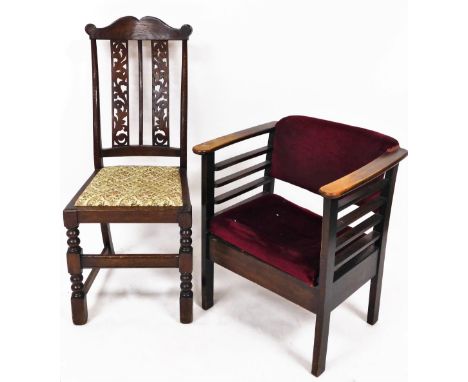 A 1920's oak occasional chair, with overstuffed back and seat, in crimson material, on chamfered stiles, 68cm high, and a com