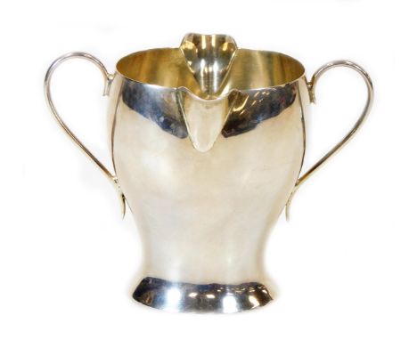 A Victorian silver double lipped Art Nouveau cream jug, by Samuel Walton Smith, with inverted body and plain handles, London 