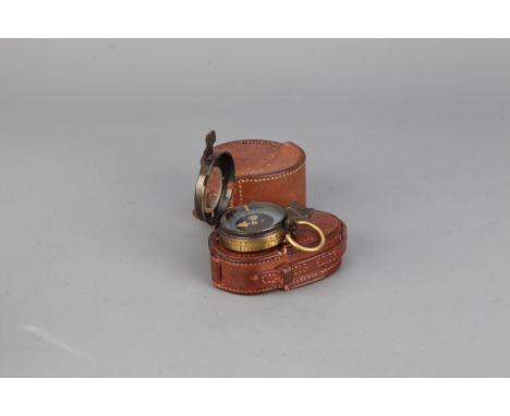 A Military Compass,&nbsp; a Verners pattern WWI prismatic compass in leather case dated 1917, with another empty leather case