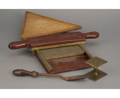 Apothecary Antiques,&nbsp; Victorian pharmacist's pill roller in brass and mahogany, a brass powder folder, a wooden pill cou