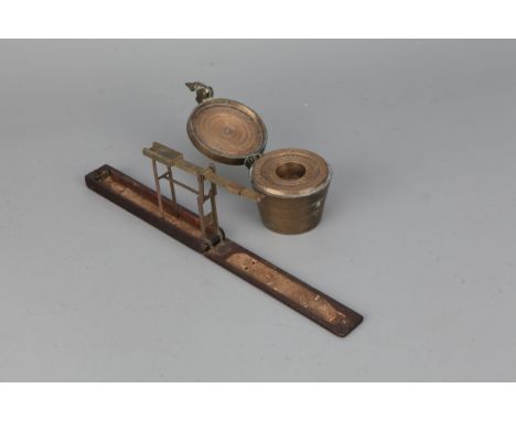 An 18th Century Guinea Balance and Cup Weights, self-erecting balance signed 'A Wilkinson of Ormskirk Late of Kirkwall near L